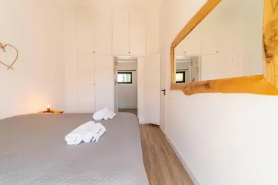 a bedroom with two towels on a bed at Falésia Coast Villa by HelloVacations in Albufeira