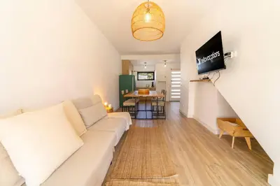a living room with a couch and a table at Falésia Coast Villa by HelloVacations in Albufeira