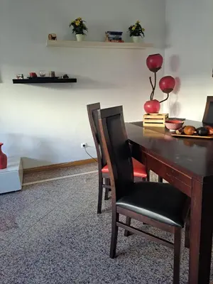 a dining room with a table and chairs at Lovely flat in the center in Faro