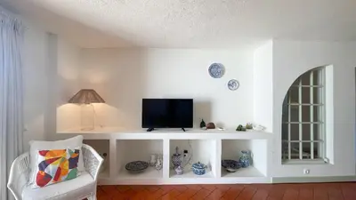 a living room with a couch and a table at T2 Monte Sol HsRentals Vilamoura in Vilamoura