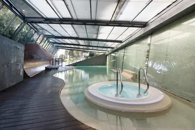 a swimming pool with a hot tub in a building at Celestial Blue Vale Do Lobo in Almancil