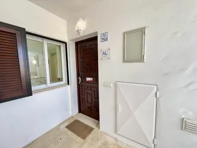 a room with a door and a window at Albufeira Balaia Golf Vilage 7 With Pool by Homing in Albufeira