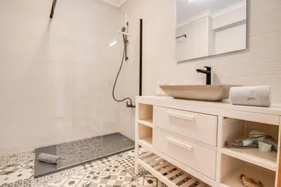 a bathroom with a sink and a shower at Nature Escape 2BR Villa Pool Wi-Fi AC in Olhos de Água