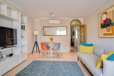 a living room with a couch and a table at Nature Escape 2BR Villa Pool Wi-Fi AC in Olhos de Água