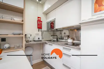 a kitchen with white cabinets and a counter top at #255 Oura Cilla by Home Holidays in Albufeira