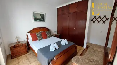 a bedroom with a bed with towels on it at Golden Algarve Apartament By Localhosting in Albufeira