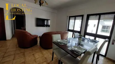 a dining room with a table and some chairs at Golden Algarve Apartament By Localhosting in Albufeira