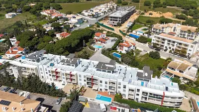 an aerial view of a large white apartment complex at Medronheira - Apt 1A by HelloVacations in Albufeira
