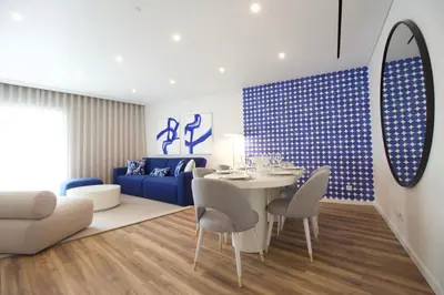 a living room with a white table and chairs at Orange Boutique Residence - Casa Farol Adults Only in Quarteira