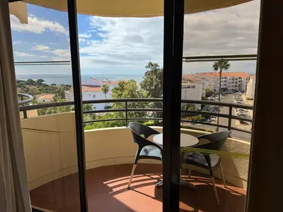 a view of a balcony with a table and chairs at Hotel Vila Galé Cerro Alagoa in Albufeira