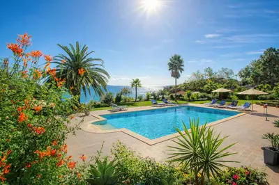an image of a swimming pool at a resort at Ocean Bliss - Panoramic Sea View - 20m to Beach - 2 Swimming Pools - Private Parking in Albufeira