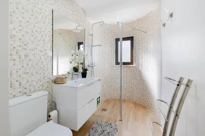 a bathroom with a toilet and a sink at Central Condo-Pool by Algarve Dream Holidays in Albufeira