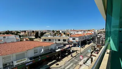 a view of a city with a train on a street at Ocean Drive by Check-in Portugal in Albufeira