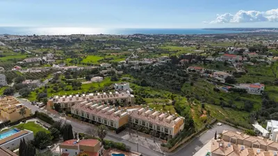 an aerial view of a city with buildings and the ocean at Villa Colina - A1 by HelloVacations in Albufeira