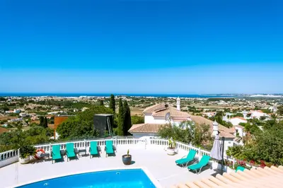 a villa with a swimming pool and a view at Casa Sonhos in Albufeira