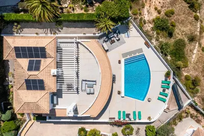 an aerial view of a house with a swimming pool at Casa Sonhos in Albufeira