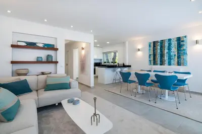 a living room with a couch and a table at Villa Celeste by SAPvillas in Vilamoura
