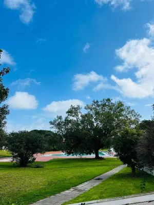 a park with trees and a rainbow in the background at Brand New Studio in Rua da Oura in Albufeira