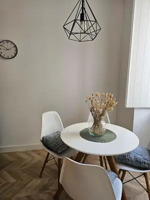 a dining room with a white table and chairs at City Center Terrace in Faro
