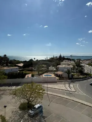 a car parked in a parking lot next to a street at Galé Mar By Albufeira Rental in Albufeira