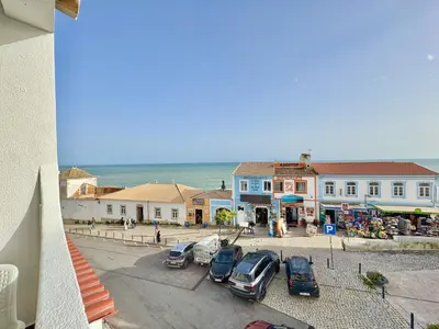a bedroom with a bed with two teddy bears on it at Albufeira Ocean View III by Homing in Albufeira