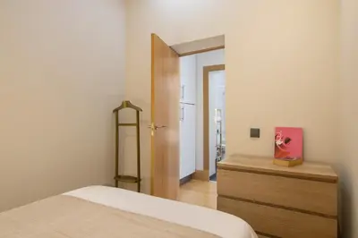 a bedroom with a bed and a dresser with a mirror at Casa Viola in Faro