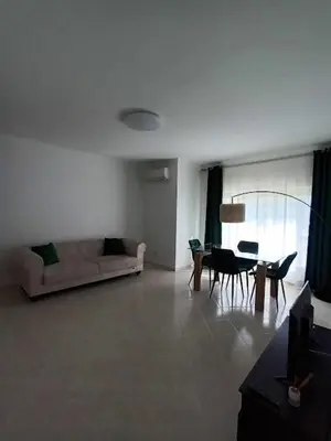 a living room with a couch and a table at T2 Faro in Faro