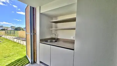 a bedroom with a bed and a bathroom with a sink at Villa Essence by Clever Details, private pool, central location in Vilamoura