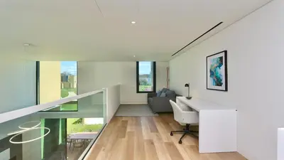 a bedroom with a blue bed and a sliding glass door at Villa Essence by Clever Details, private pool, central location in Vilamoura
