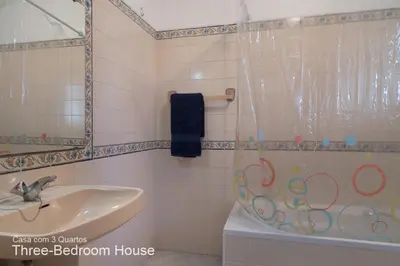 a bathroom with a sink and a shower at Akivillas Quarteira Relax in Quarteira