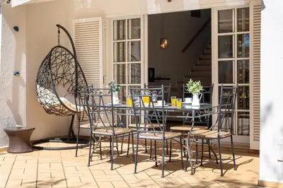a dining room with a table and chairs at Casa da Paz by Algarve Holidays in Albufeira
