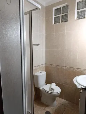 a bathroom with a toilet and a sink at Casa Gomez A in Albufeira