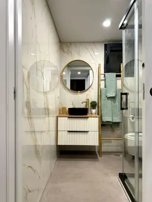 a bathroom with a sink and a mirror at Acoteias Cosy Studio in Albufeira