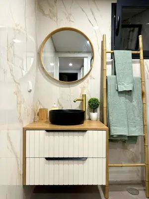 a bathroom with a sink and a mirror at Acoteias Cosy Studio in Albufeira