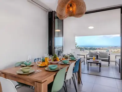 a dining room with a wooden table and chairs at Apartment Villa Magna by Interhome in Albufeira