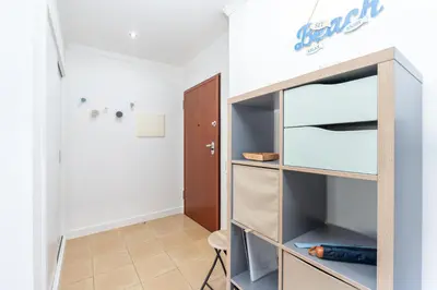 a bedroom with a bed and a window at BnB Homes Apartments near Ocean & Lush Nature 500 m away from the ocean in Guia