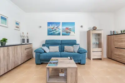 a parking lot in front of a large building at BnB Homes Apartments near Ocean & Lush Nature 500 m away from the ocean in Guia