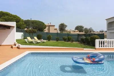 a swimming pool with a inflatableoglehett at Vila de Santa EulAlia III - Albufeira in Albufeira