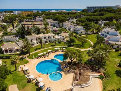 an aerial view of a resort with two swimming pools at Balaia Golf Village T2 a 10 minutos da praia in Olhos de Água