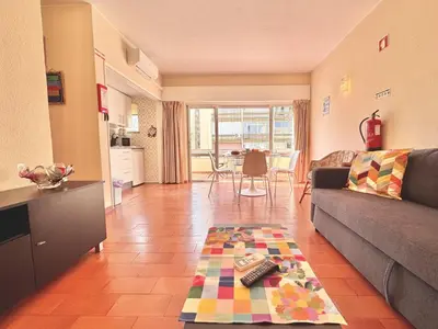 a living room with a couch and a table at Vilamoura Central 10 by Homing in Vilamoura