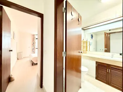 a bathroom with a toilet and a sink and a mirror at Home Out Albufeira - T1 Oura in Albufeira