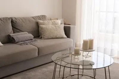 a living room with a couch and a glass table at Praia Village II - Peaceful condominium by HD in Vilamoura