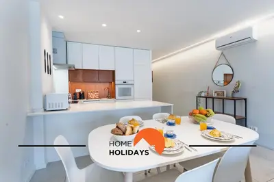 a living room with a couch and a window at #308 Marcilia Apartamento by Home Holidays in Albufeira