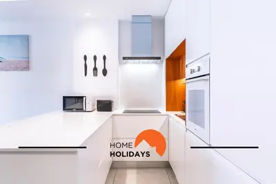 a kitchen with a sink and a microwave at #308 Marcilia Apartamento by Home Holidays in Albufeira