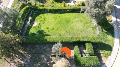 an aerial view of a garden with an orange arrow at #314 T2 Serenity by Home Holidays in Albufeira