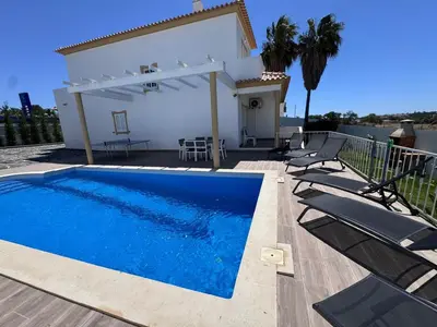 a swimming pool in front of a villa at Villa Menina by Ocvillas in Albufeira