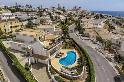 an aerial view of a house with a swimming pool at Villa Sitambo- Pool & Sea View in Albufeira