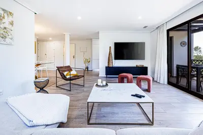 a living room with a couch and a table at Apartamento T3 Praia da Falésia - PINE SUN PARK in Albufeira