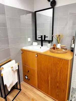 a bathroom with a sink and a mirror at casa da vila 33 in Faro