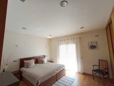 a bedroom with a bed and a window at Villa Ocean Gale in Albufeira